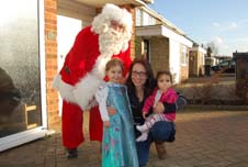 Santa visits families