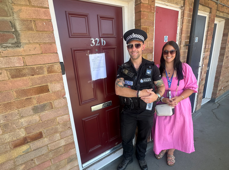 PC Ben Kirby from Herts Constabulary with the Council's Anti-Social Behaviour Officer Carmel Sheringham-Ford serving the Closure Order