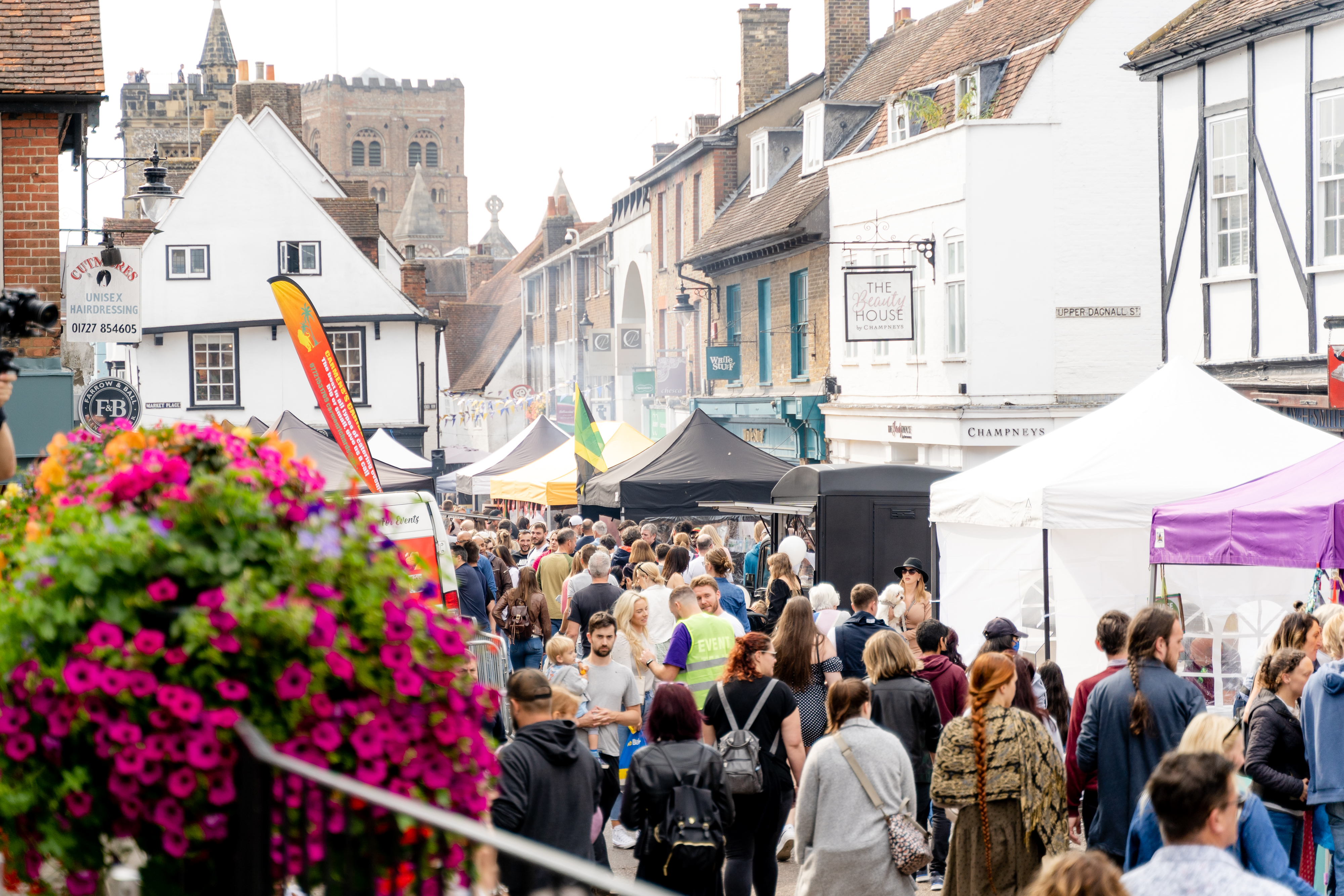 crowds enjoying busy street festival - seen from above