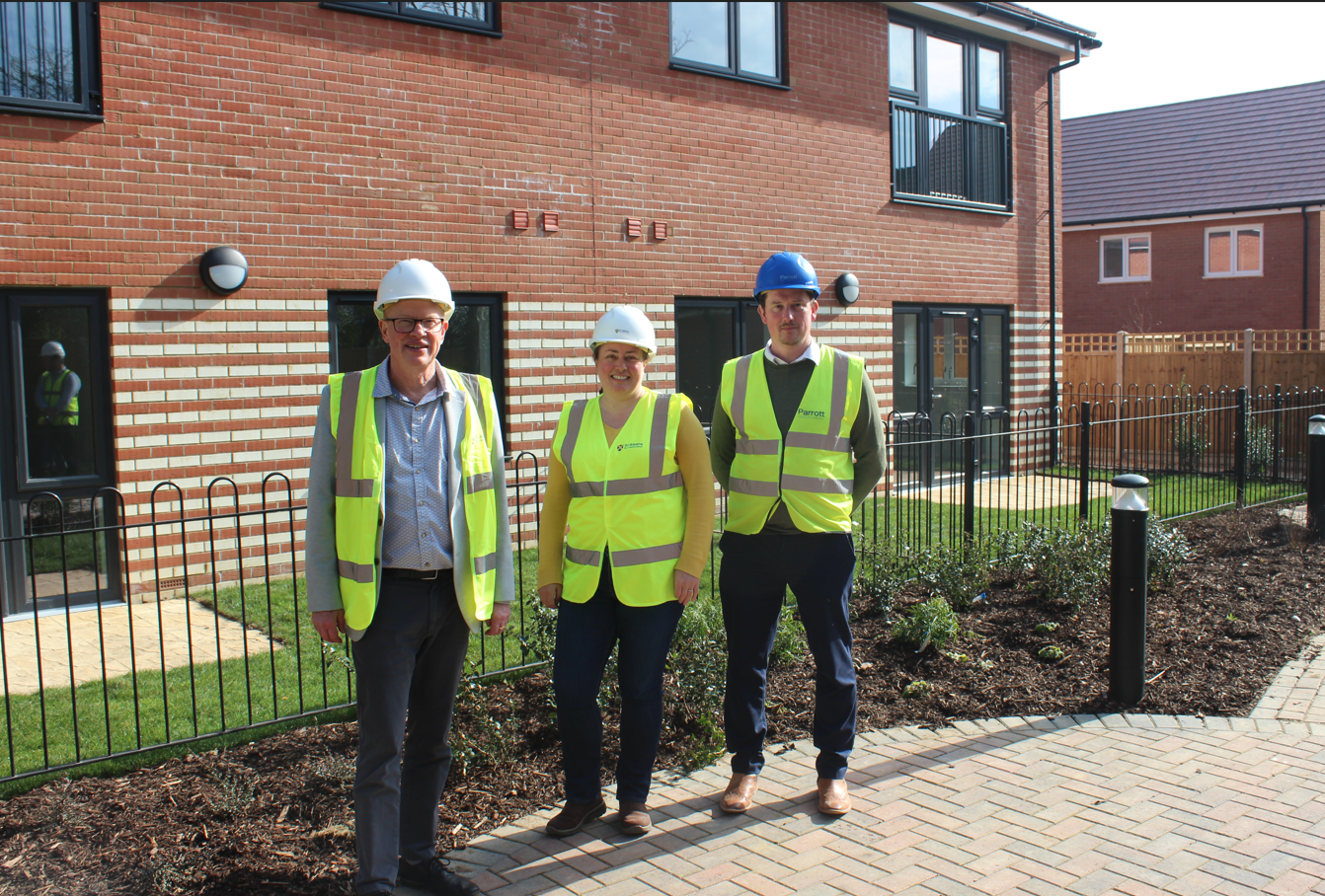 Cllr Taylor, centre, at The Hedges development