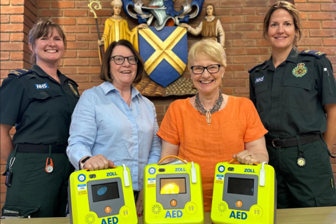 : left to right, Monica Cherry, Cllr Griffiths, Cllr Heritage and Vivienne Ford with the three defibrillators.